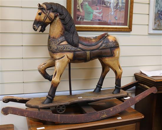 A Toy horse mounted on rockers Height 85cm.